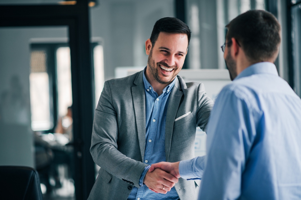 businessmen-handshaking-partnering-with-creditors